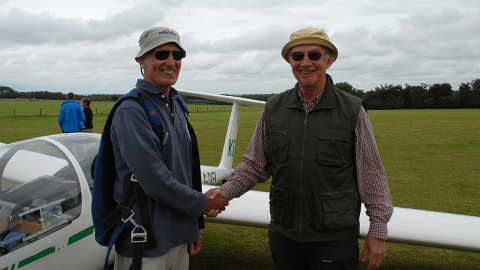 Chris (right) resolos in a glider